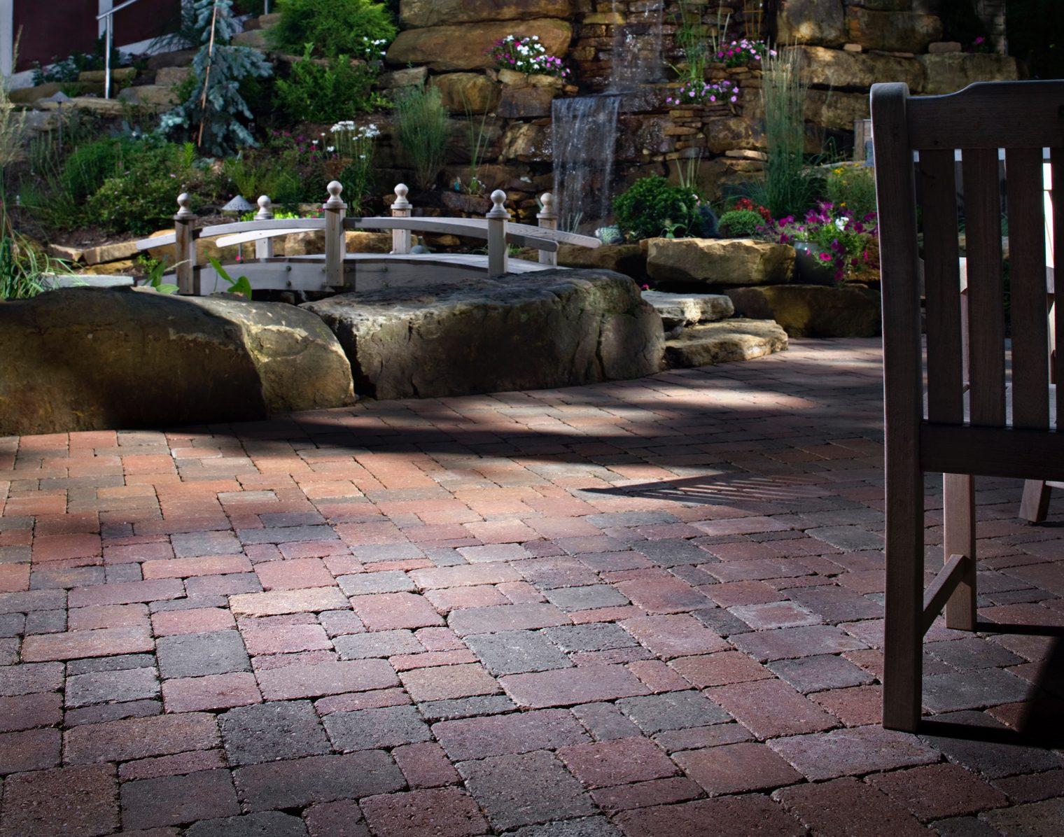 Asymmetrical cobble paver patterns