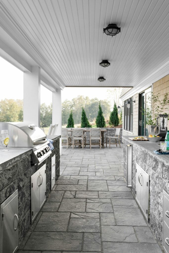 HGTV Dream Home 2021 Outdoor Spaces: rustic stone outdoor kitchen and grill island