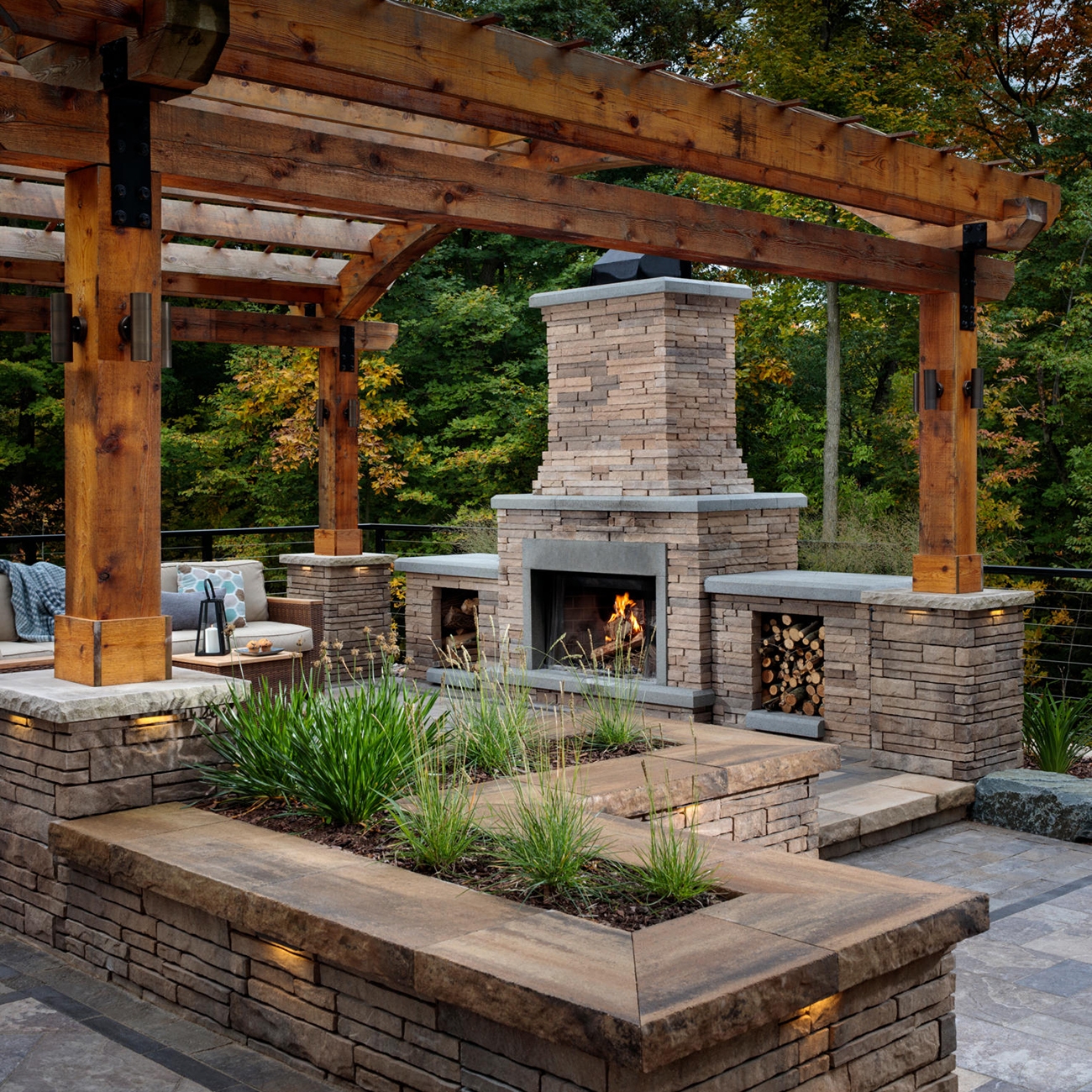 stacked stone bordeaux fireplace with pergola