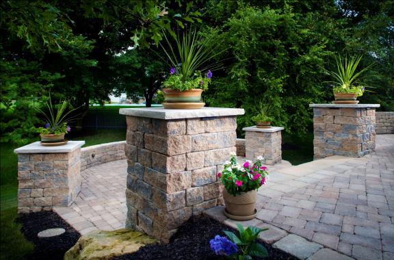 Make a statement by adding a potted plant on top of Belgard columns.