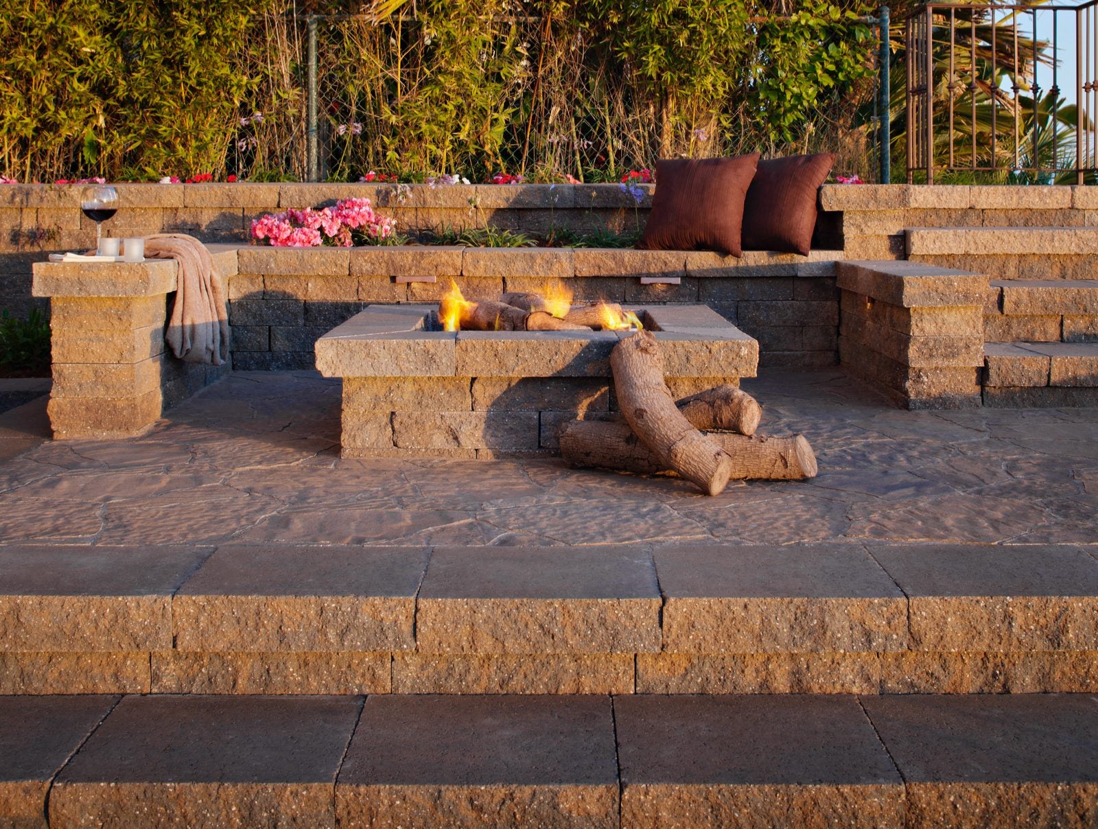 terraced fire pit patio with built-in enclosed seating