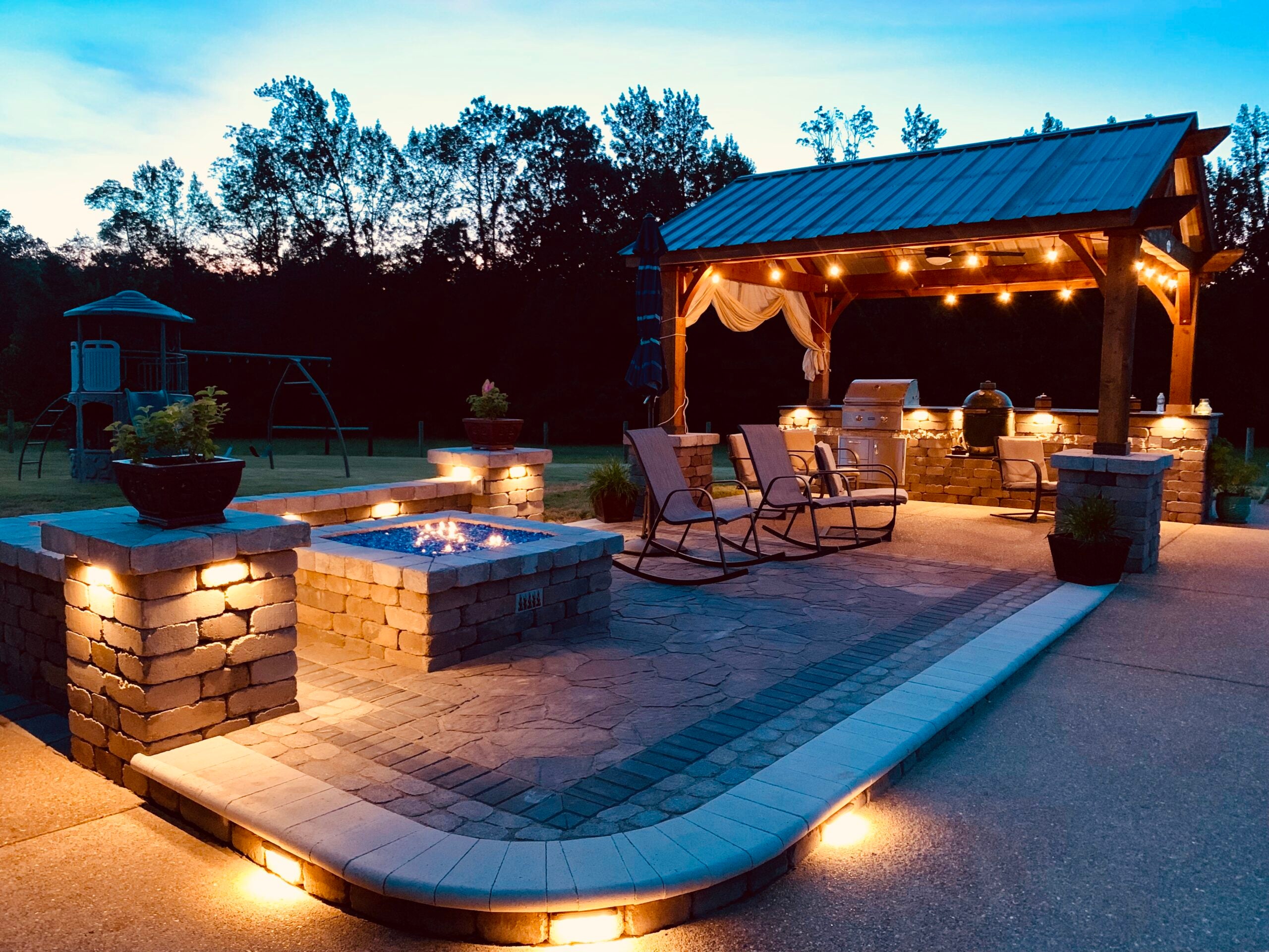 stone fire pit and outdoor kitchen