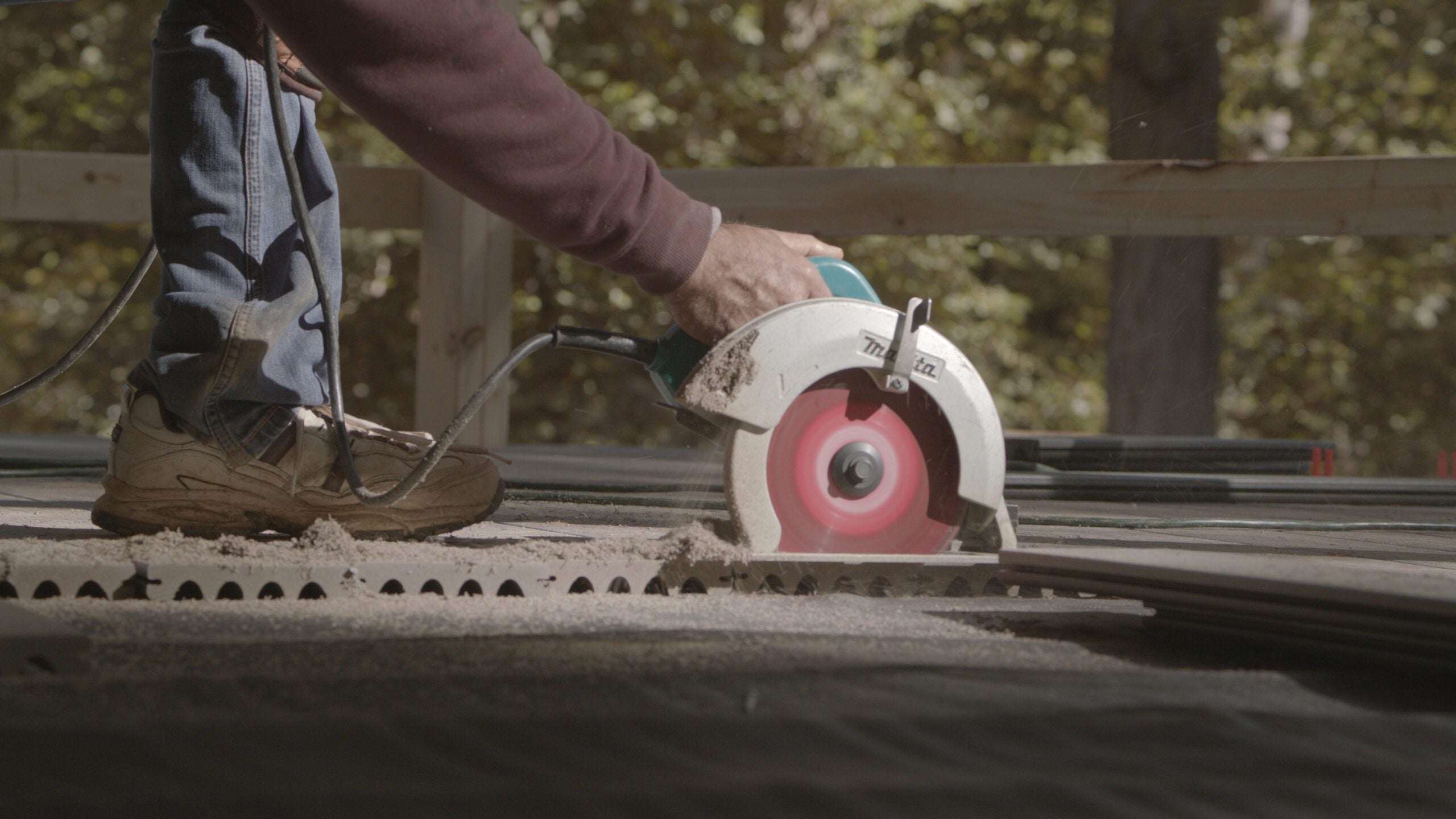 cutting capped composite boards deck