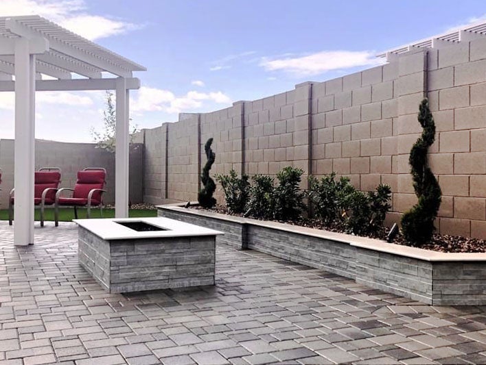 contemporary fire pit and landscape wall