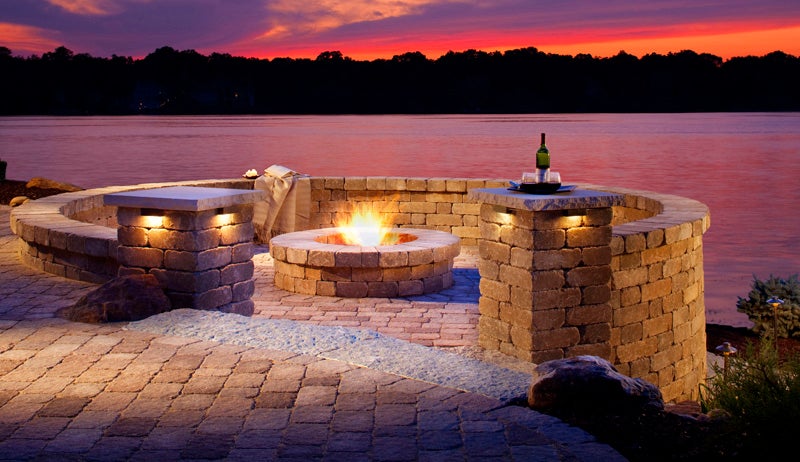 By enclosing this exposed firepit with a Weston Stone wall, 
