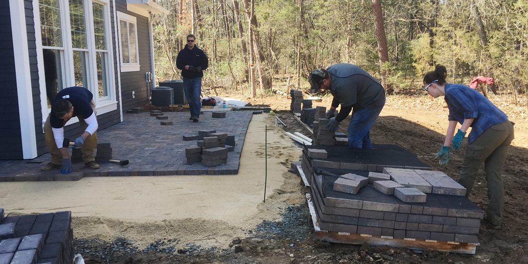 Belgard volunteers paver installation