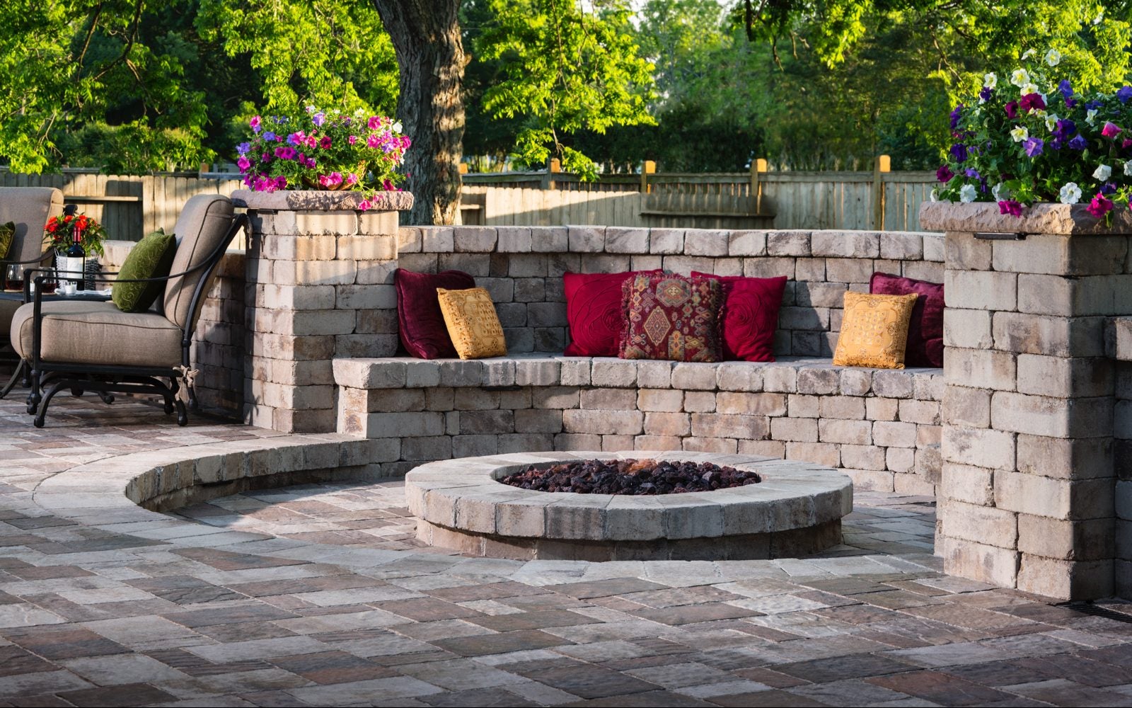 arched wall patio paver fire pit design ideas