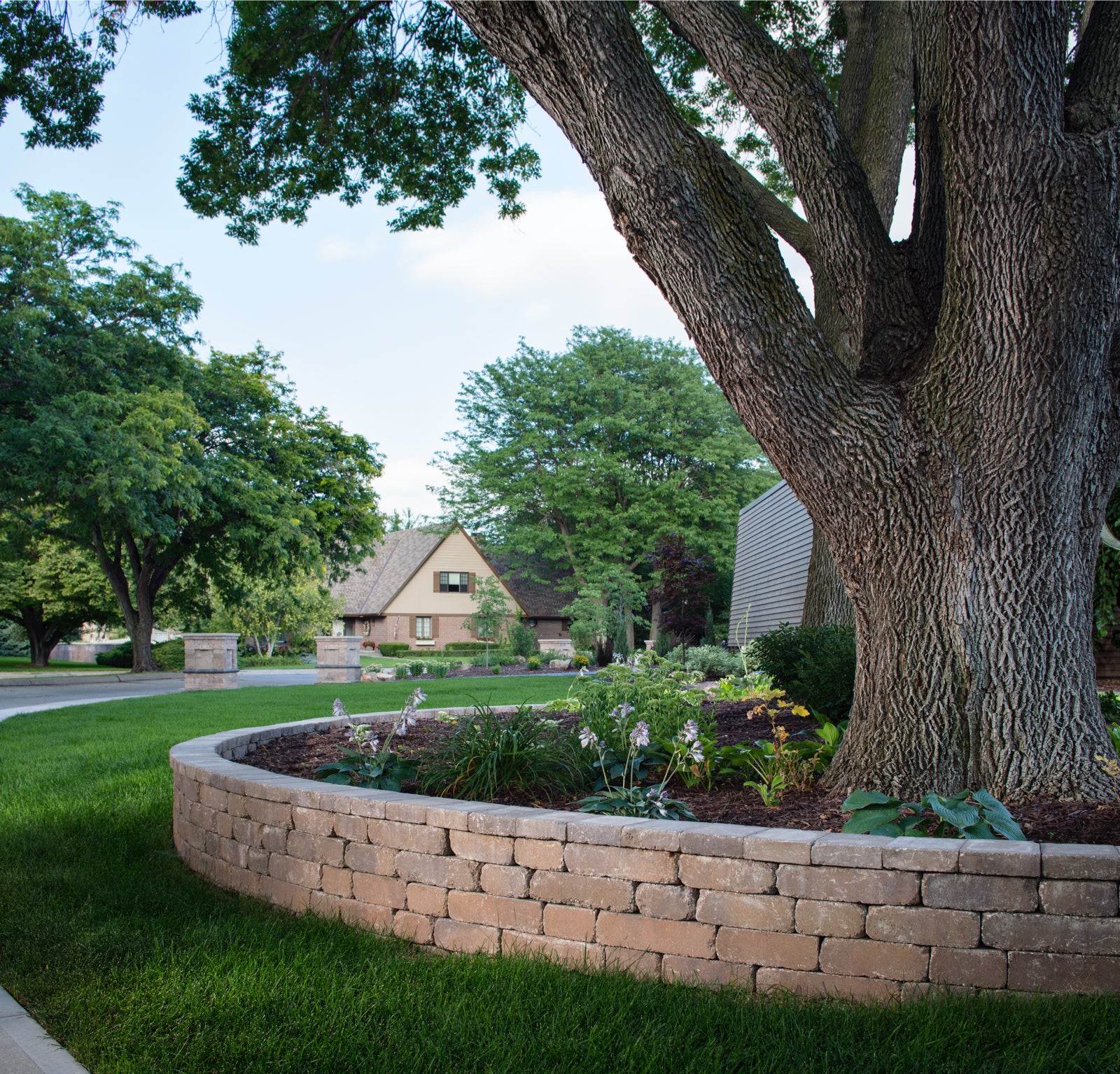 Weston Stone™ Tree Retaining Wall with Built-in Planter