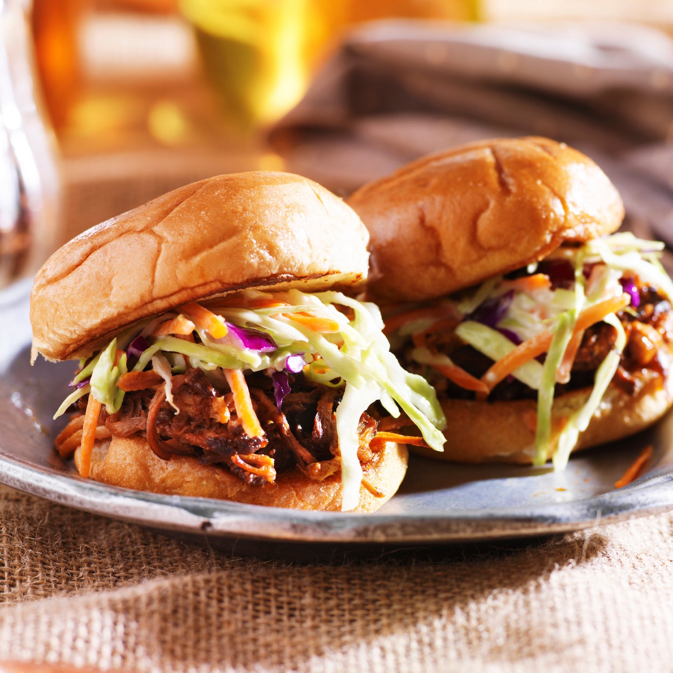 Pulled pork sliders dressed with coleslaw.