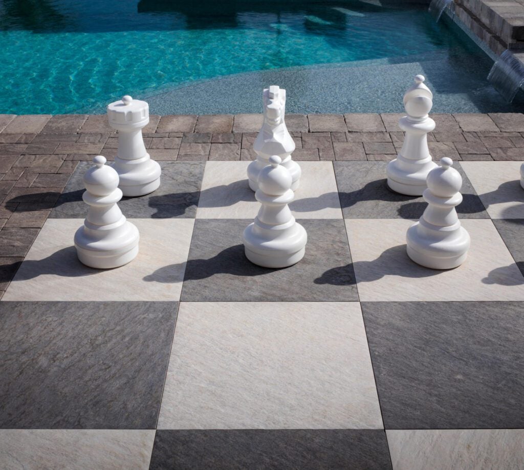 Hardscape chess board near pool 