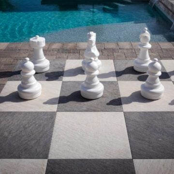 Hardscape chess board near pool