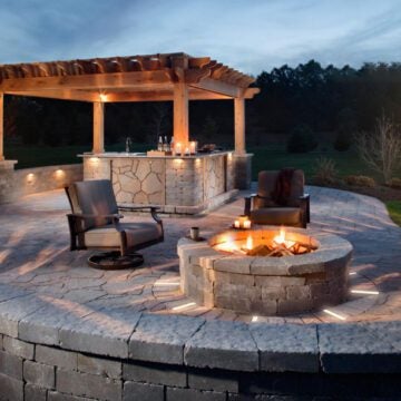 Outdoor lighting with paver lights, firepit and pillar lights