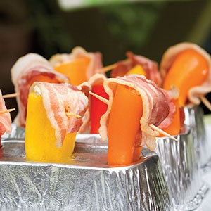 Bacon-wrapped stuffed peppers, ready for the grill. (Photo credit: Photo: William Dickey; Styling: Lisa Powell Bailey - Time Inc.)