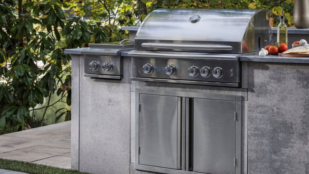 outdoor kitchen island with grill and storage