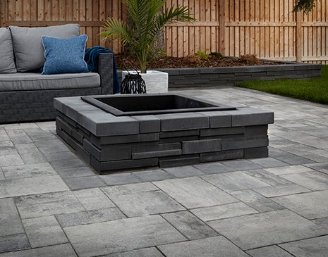 Built in concrete patio seating with paver fire pit 