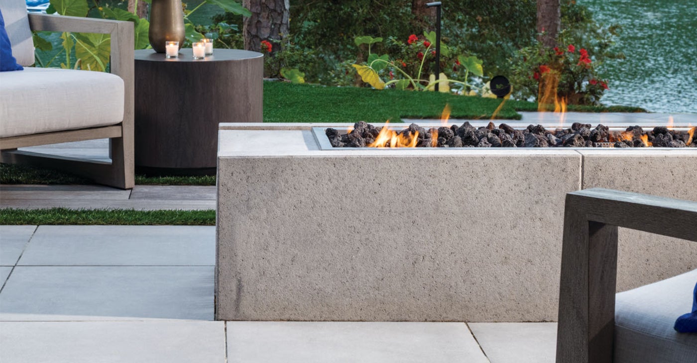 gas insert fire pit in backyard paver patio