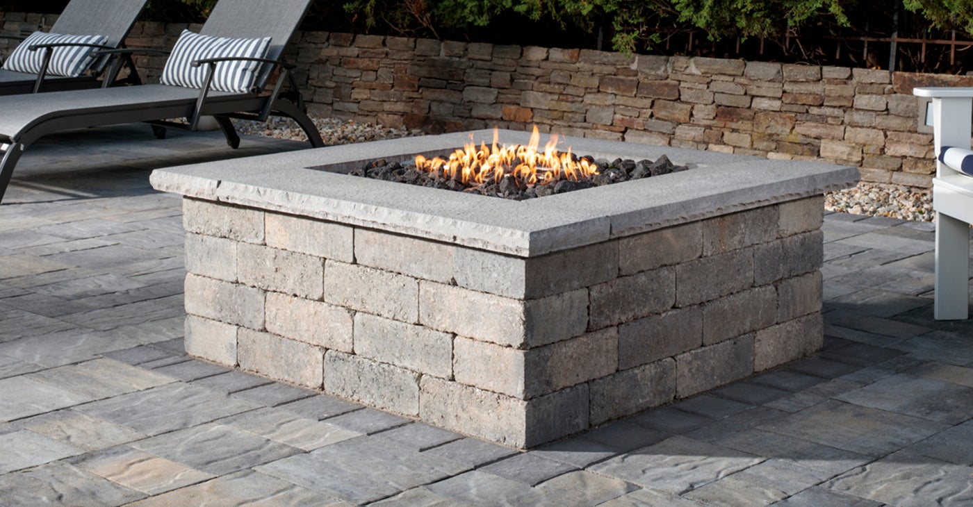 stone wall backyard patio fire pit