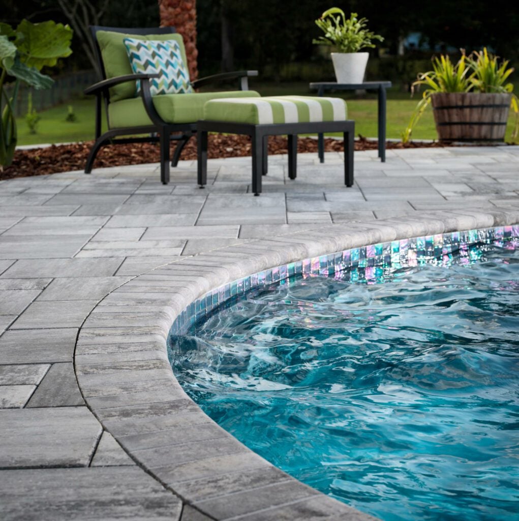 Poolscape with outdoor furniture and cushions