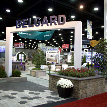 Belgard booth at Hardscape North America. The booth features a white arch with Belgard spelled out at the top
