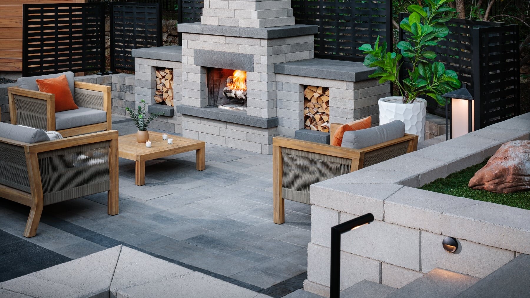 An outdoor living room with a fireplace