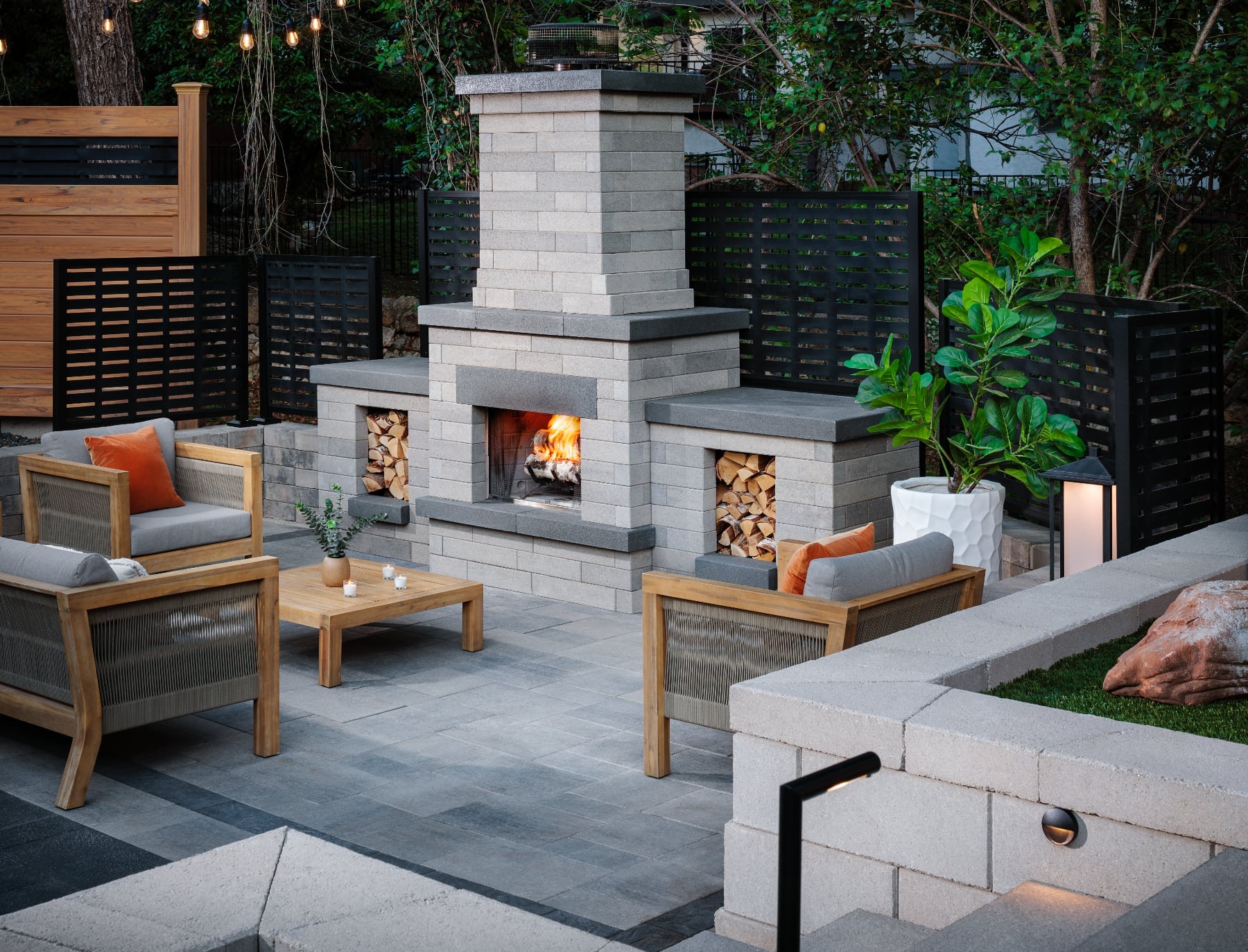 An outdoor living room with a fireplace