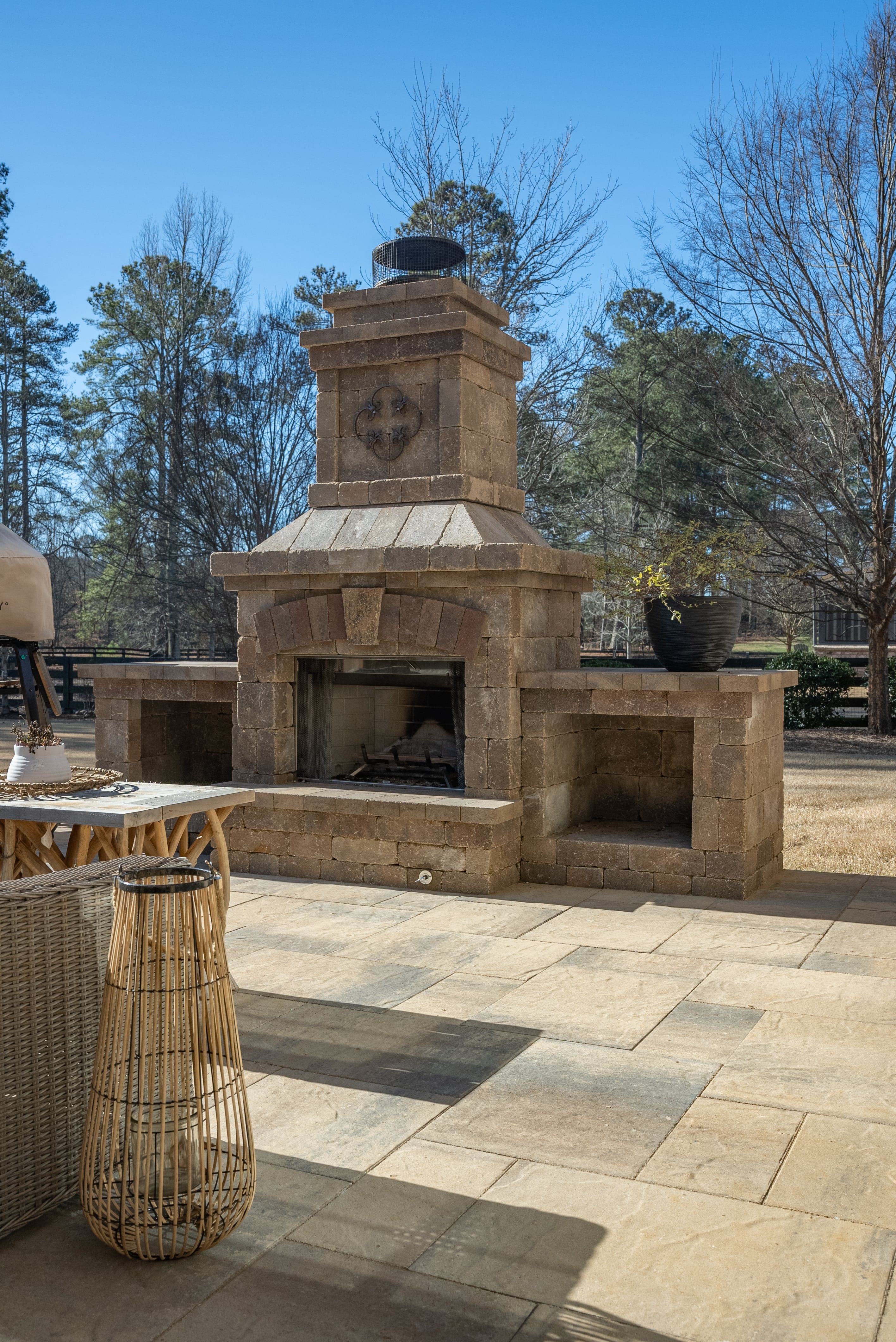 outdoor fire place area with a table in the bottom left corner