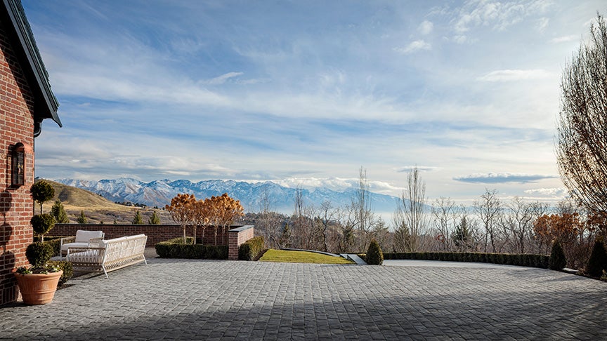 New residence in Salt Lake City, Utah designed by influencer, Tan France, includes hardscapes with Belgard Charlestone Pavers and walls.