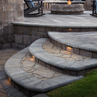 Outdoor patio and steps featuring Belgard Mega-Arbel pavers.