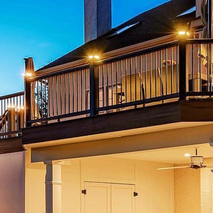 Outdoor patio and fence with accent lighting.