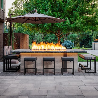 A firepit built into an outdoor kitchen island